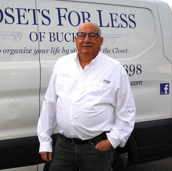 Aaron Lewis, founder of Closets For Less, in front of the company van