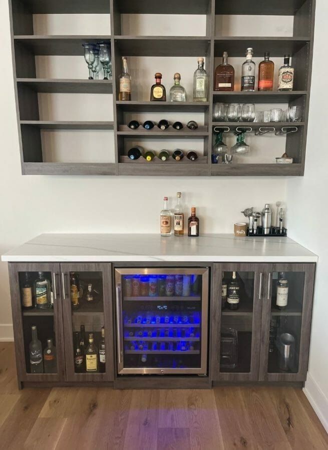 Home bar with open shelving and a built-in wine rack