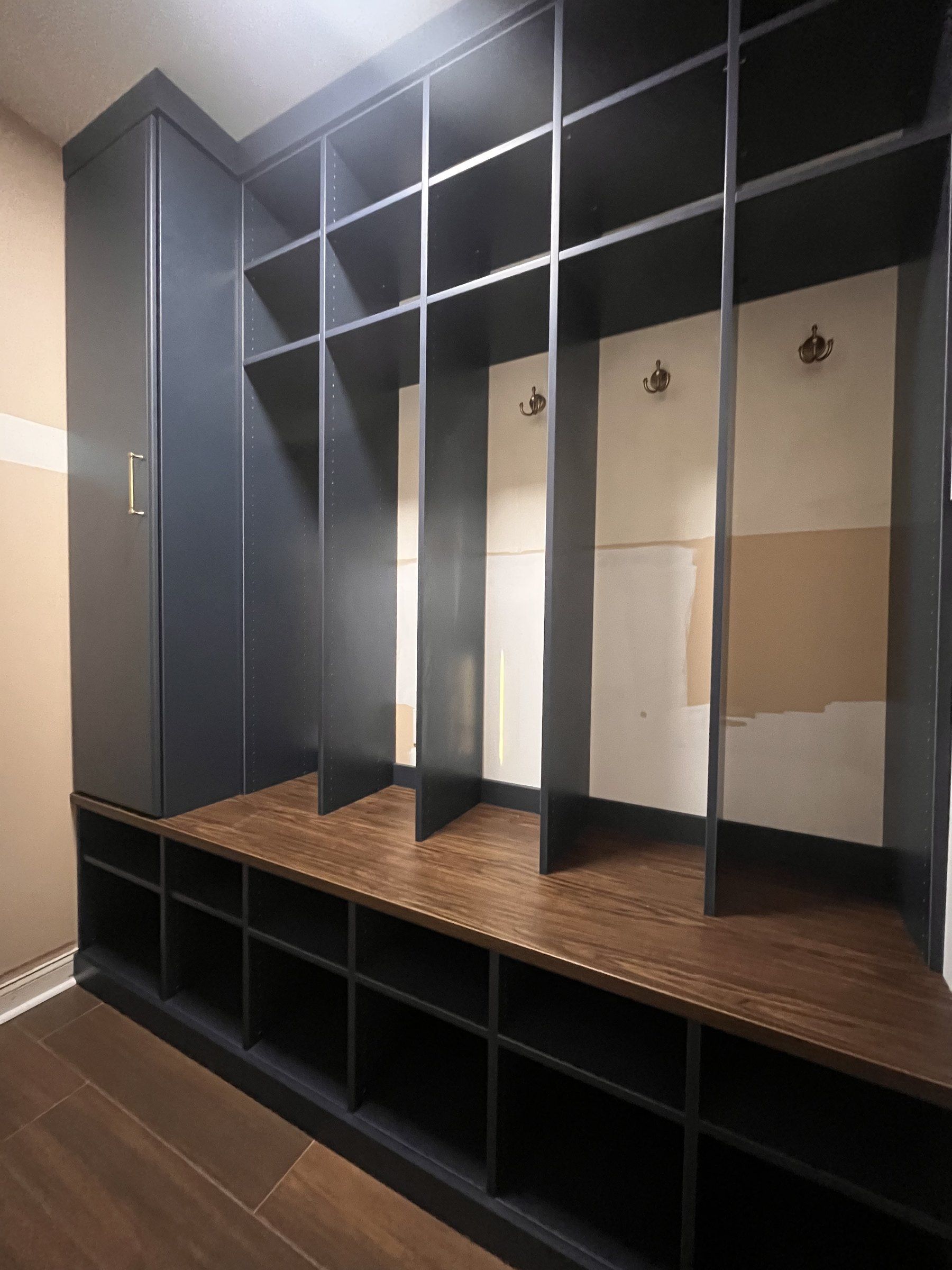 Navy custom mudroom lockers with a cubby bench
