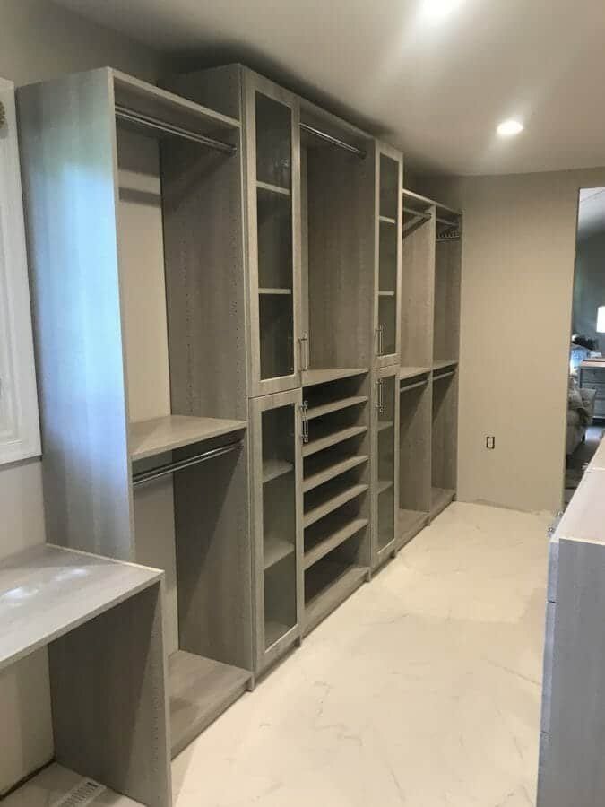 Gray walk-in closet with a built-in vanity desk