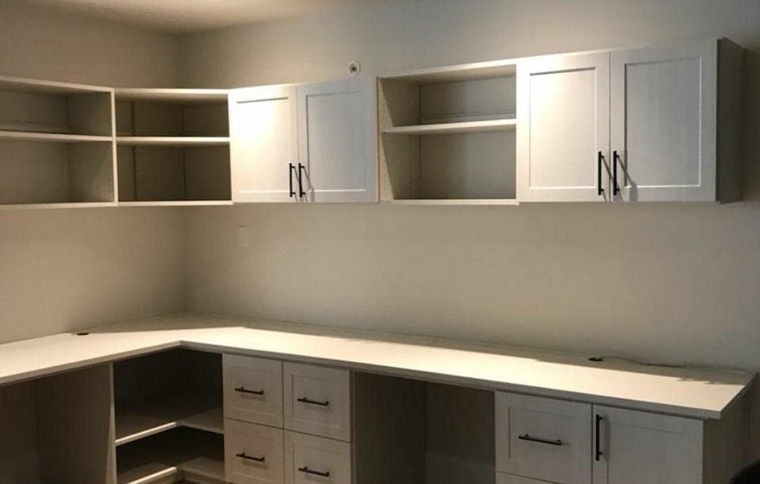 White corner desk with upper cabinets and open shelves