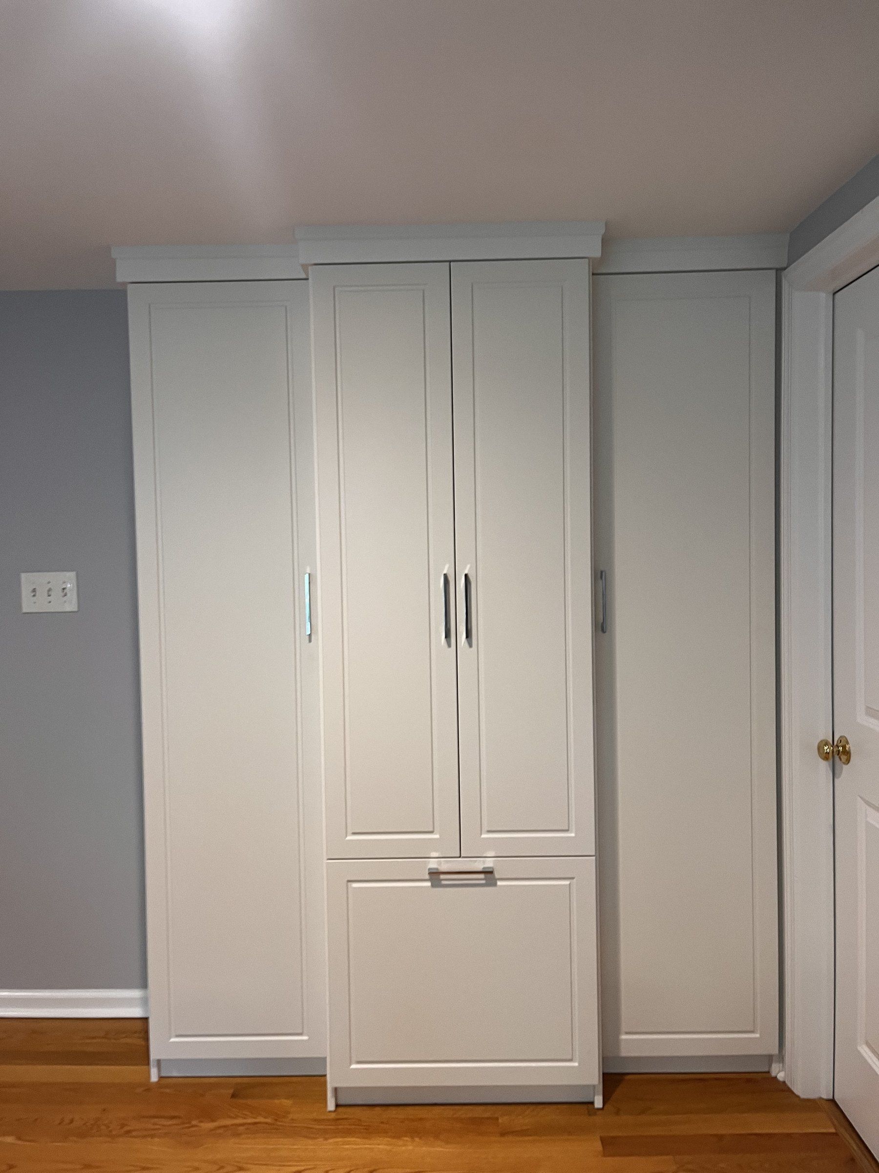 White built-in wardrobe cabinets with shaker doors
